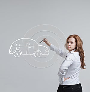 Woman drawing car, concept on the subject of