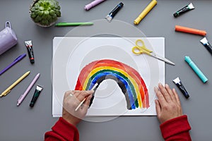 Woman Drawing Rainbow Top Down