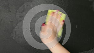 Woman drawing a simple electric led lamp on the blackboard. Idea concept.