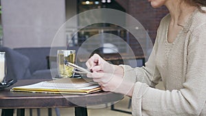 Woman drawing a sketch at cafe