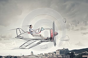 Woman in drawn airplane