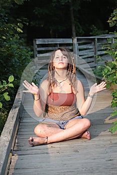 Woman with Dread Locks Meditating