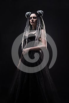 Woman with dreads and black gothic dress