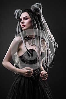 Woman with dreads and black gothic dress