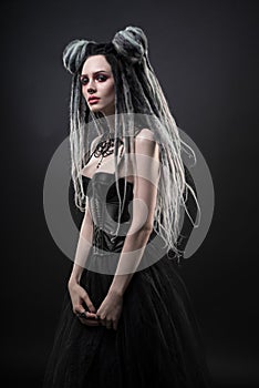 Woman with dreads and black gothic dress