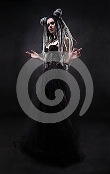 Woman with dreads and black gothic dress