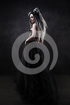 Woman with dreads and black gothic dress