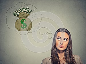 Woman dreaming of financial success money