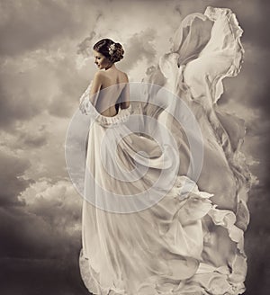 Woman dress, artistic white blowing gown, waving a