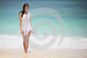 Woman in dress on beach