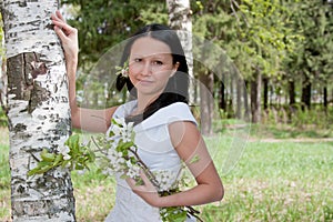 woman in the dress of fiancee in summer in a park