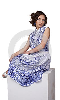 Woman in a dress with a pattern gzhel