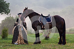 Woman in dress royal baroque riding