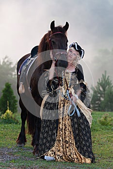 Woman in dress royal baroque riding