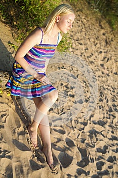 Woman in dress take sunbath at day