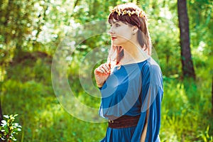 Woman in a dress in the woods