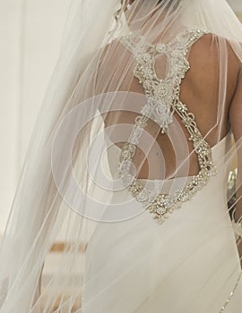 Woman dressed as a bride before entering the church