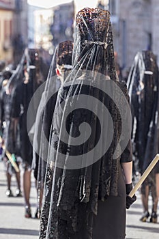 Woman dressed in mantilla during a procession of holy week photo
