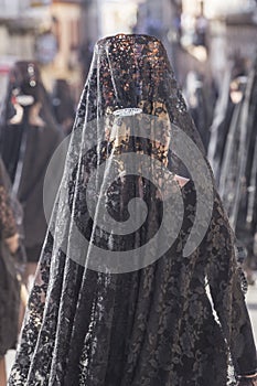 Woman dressed in mantilla during a procession of holy week photo