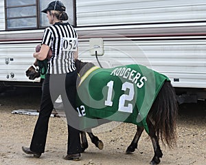 Referee Woman leading Aaron Rodgers Pony