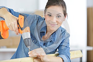 woman drilling wood