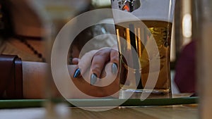 A woman drink beer at the bar