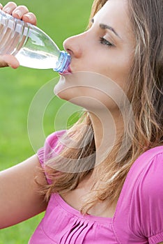 Woman drink water grass