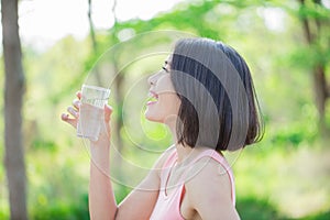 Woman drink water happily