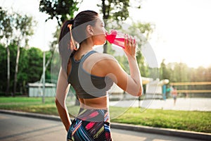 Woman drink water from sport bottle