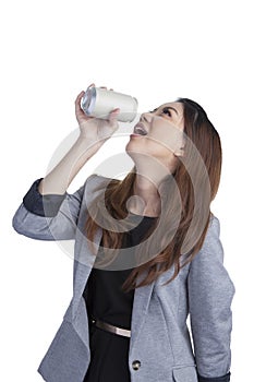 Woman drinking from blank can