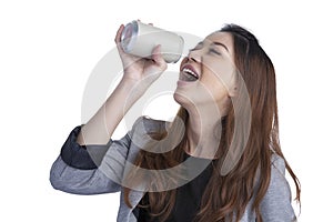 Woman drinking from blank can