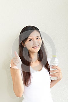 Woman drinking a bottle of water