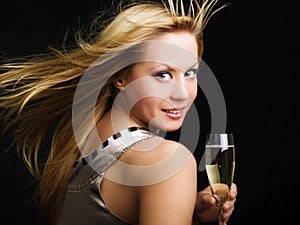 Woman drinking champange and celebrating