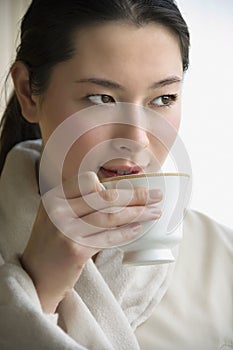 Woman drinking coffee.