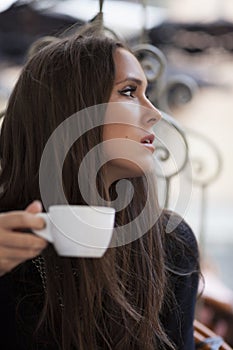 Woman drinking coffee in coffe shop