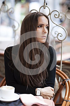 Woman drinking coffee in coffe shop