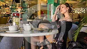 Woman drinking coffee in the morning at restaurant soft focus on the eyes