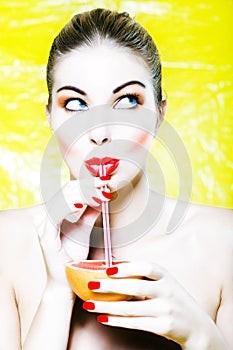 Woman drinking grapefruit juice