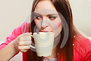 Woman drinking hot coffee beverage. Caffeine.