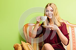 Woman drinking hot coffee beverage. Caffeine.