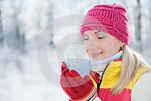 Woman drinking hot tea