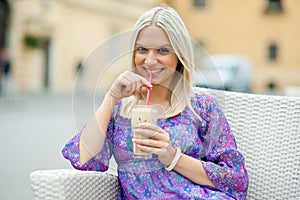 Woman drinking ice coffee