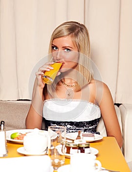 Woman drinking orange juice