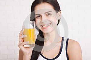 Woman drinking orange juice Beautiful mixed-race Asian, Caucasian model.