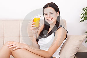 Woman drinking orange juice Beautiful mixed-race Asian, Caucasian model.