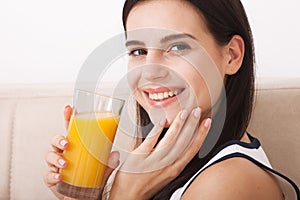 Woman drinking orange juice Beautiful mixed-race Asian, Caucasian model.