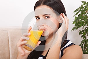 Woman drinking orange juice Beautiful mixed-race Asian, Caucasian model.