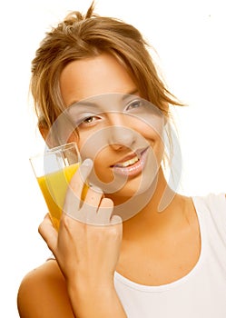 Woman drinking orange juice close up