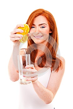 Woman drinking orange juice smiling