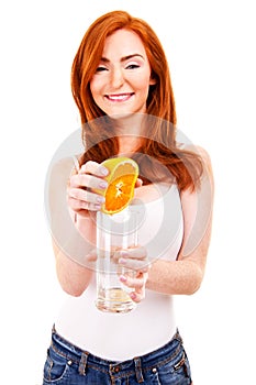 Woman drinking orange juice smiling